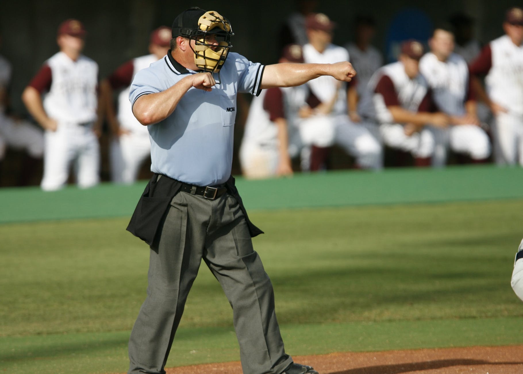 tilt shift photography of a baseball referee